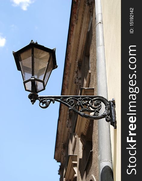 Street Lamp on a high metal lamppost with blue sky background