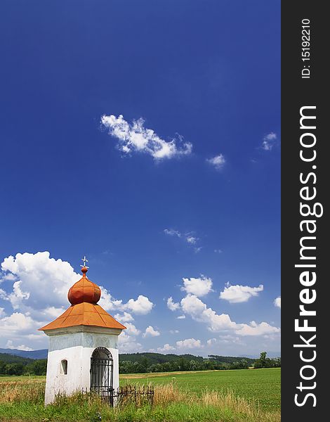 Small old chapel and blue sky. Small old chapel and blue sky