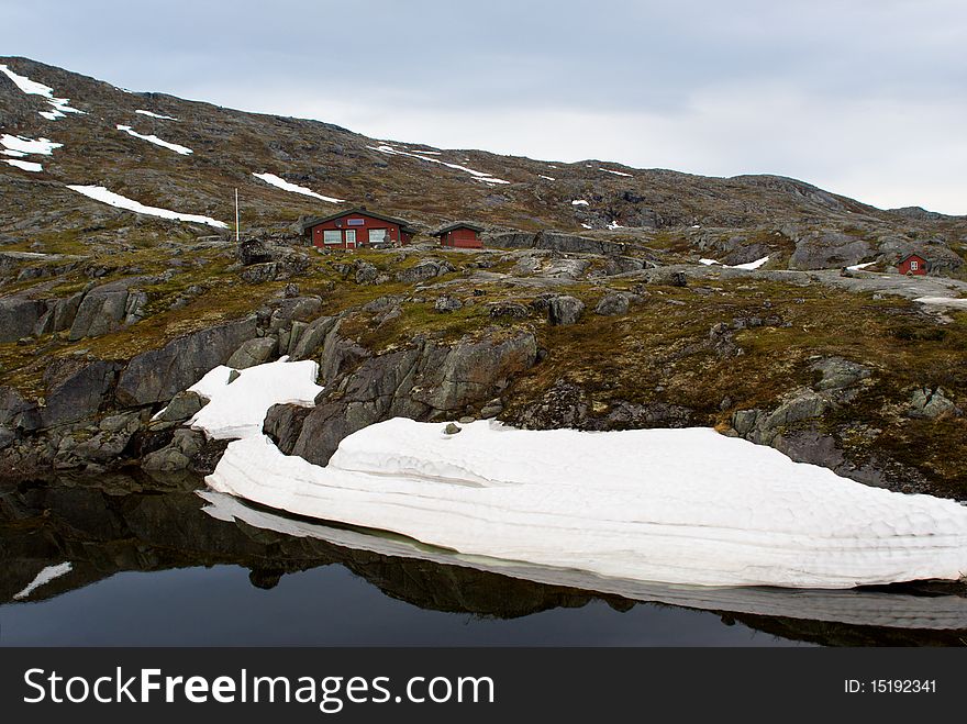 Mountain landscape with a lake and snow