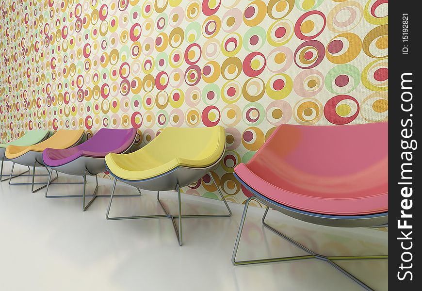 Colorful chairs stand against the wall.