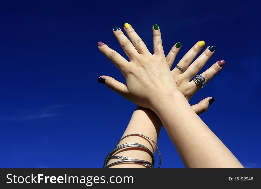 Woman hands with the background of sky.