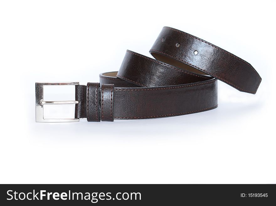 New black leather belt isolated on white background. New black leather belt isolated on white background