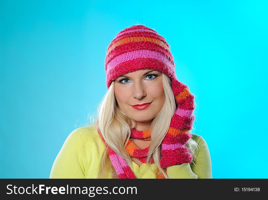 Seasonal portrait of pretty funny woman in hat and gloves smiling