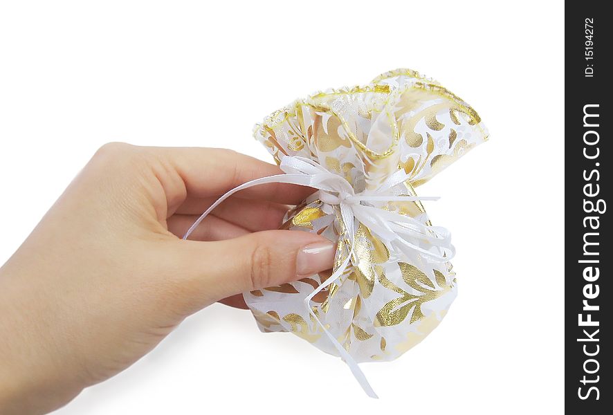 Gift in female hand, isolated on a white background