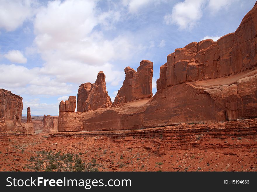 The stunning red rock walls of Park Avenue welcome visitors to Arches National Park in southern Utah's red rock country.