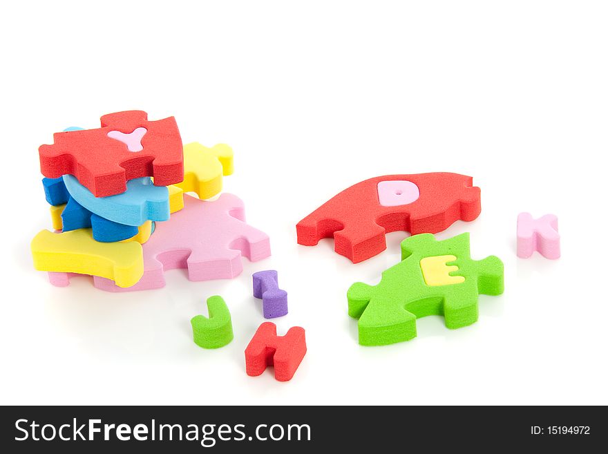 Stack of colorful puzzle pieces isolated over a white background. Stack of colorful puzzle pieces isolated over a white background