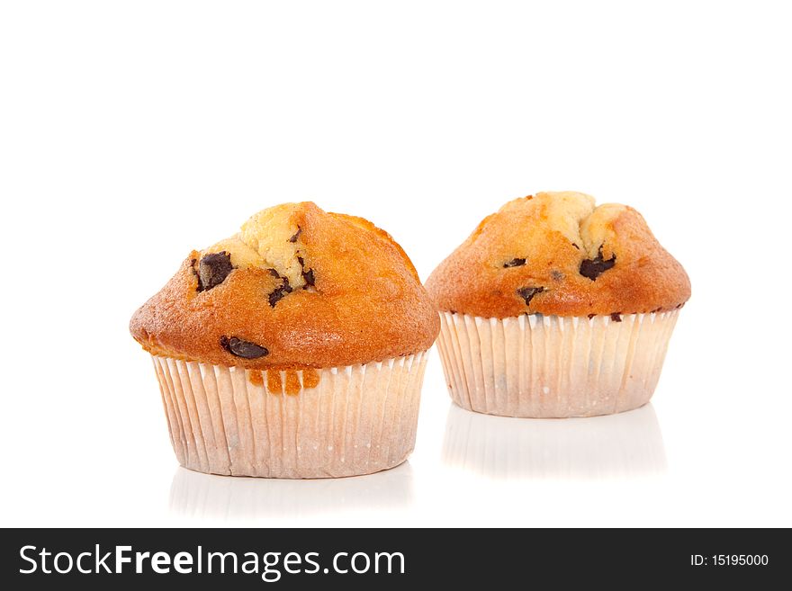 Two tasteful muffins with chocolate isolated over white