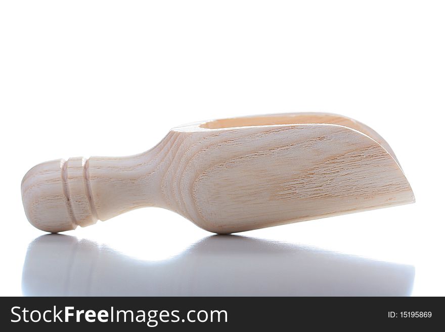 Wooden spoon for loose products on a white background.