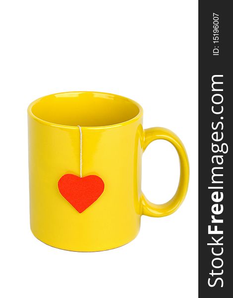 Tea bag with red heart-shaped label in yellow cup isolated on white. Tea bag with red heart-shaped label in yellow cup isolated on white