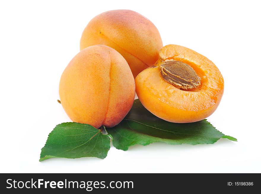 Three Apricot On A White Background