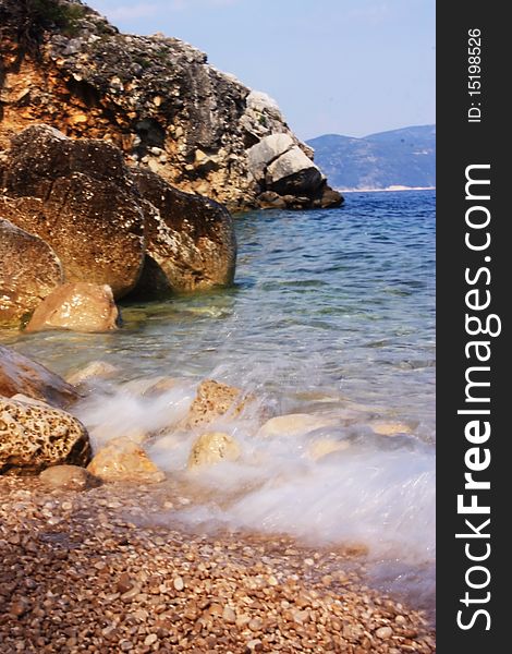 Sea coast with clear water, rocks and cliffs. Sea coast with clear water, rocks and cliffs