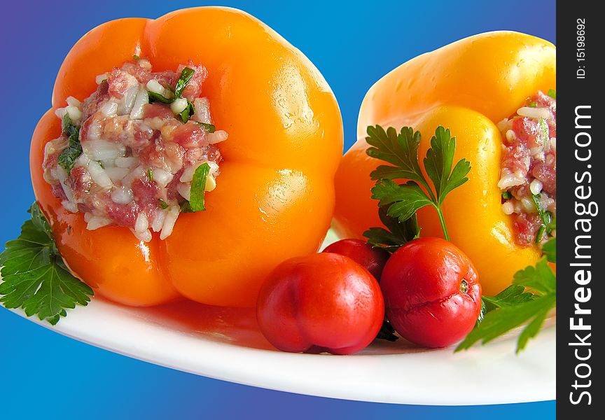 Food, stuffed peppers  on a plate the blue, herb. Food, stuffed peppers  on a plate the blue, herb