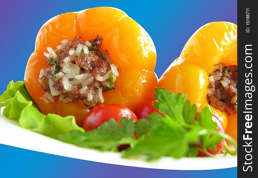 Food, stuffed peppers  on a plate the blue, and  herb. Food, stuffed peppers  on a plate the blue, and  herb