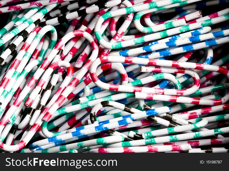 Background of Colourful paperclips closeup