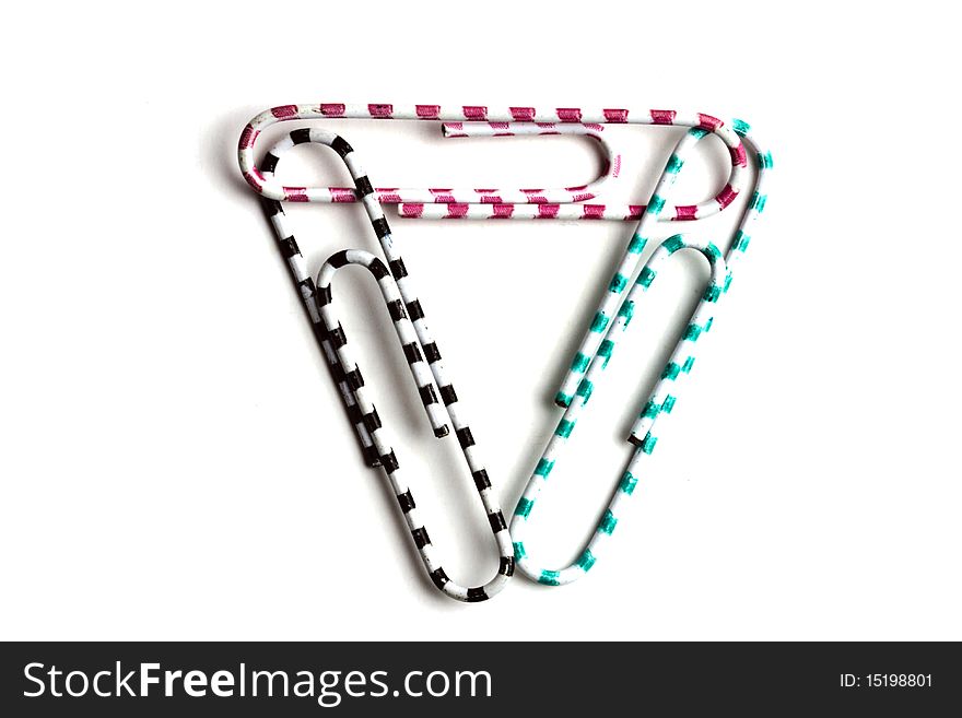 Three multicolored paperclips isolated on white