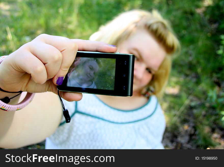 Young woman taking a self picture.