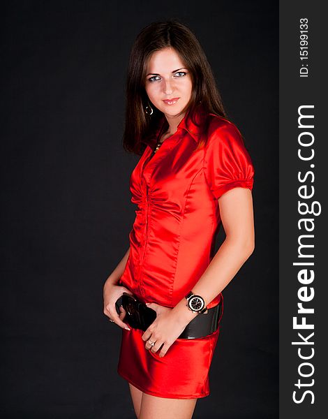 Portrait of a charming brunette in red. Portrait of a charming brunette in red