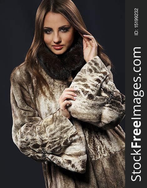 Attractive woman in fur coat