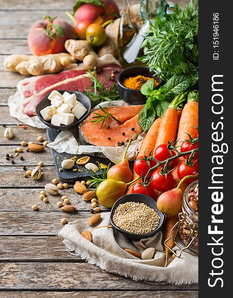 Balanced nutrition concept for clean eating flexitarian meditteranean diet. Assortment of healthy food ingredients for cooking on a wooden kitchen table. Balanced nutrition concept for clean eating flexitarian meditteranean diet. Assortment of healthy food ingredients for cooking on a wooden kitchen table