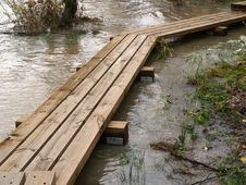 Wooden Bridge Through Flooded River Royalty Free Stock Photography Wooden Bridge Through Flooded River Royalty Free Stock Photography