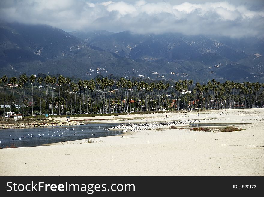 Beautiful coastline with sand beach in front and ocean in background (004). Beautiful coastline with sand beach in front and ocean in background (004)