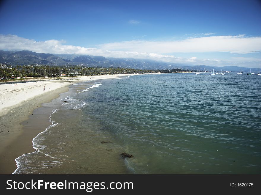 Beautiful coastline with sand beach in front and ocean in background (005). Beautiful coastline with sand beach in front and ocean in background (005)