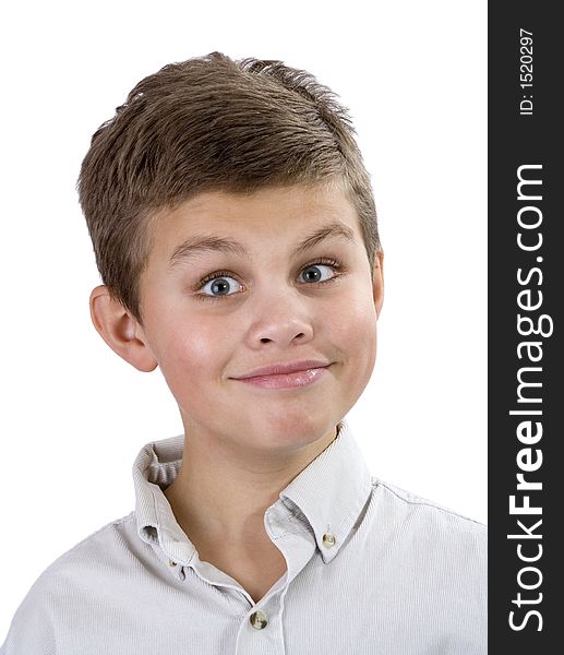 Portrait of a young boy with a silly, goofy, surprised smile. Isolated on a white background. Portrait of a young boy with a silly, goofy, surprised smile. Isolated on a white background.