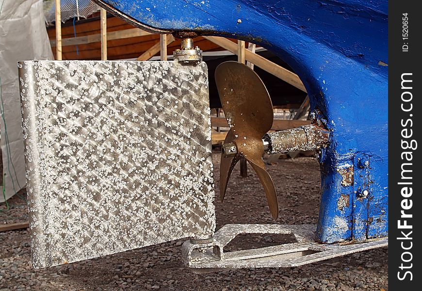 Rudder and propeller of sea yacht two, close-up