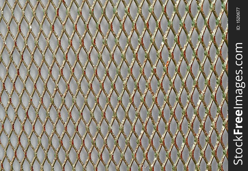 Background from metal painted net, close-up