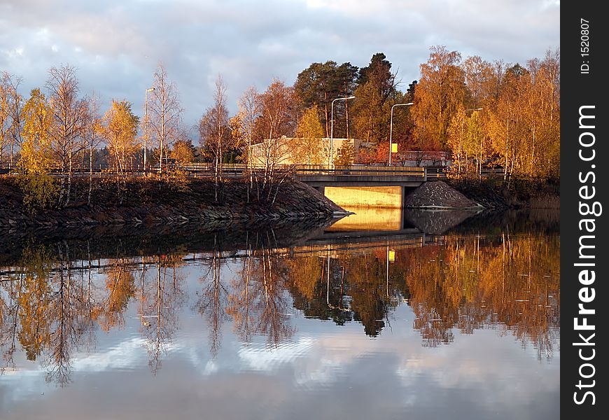 Reflections Of Trees And Clouds On Water