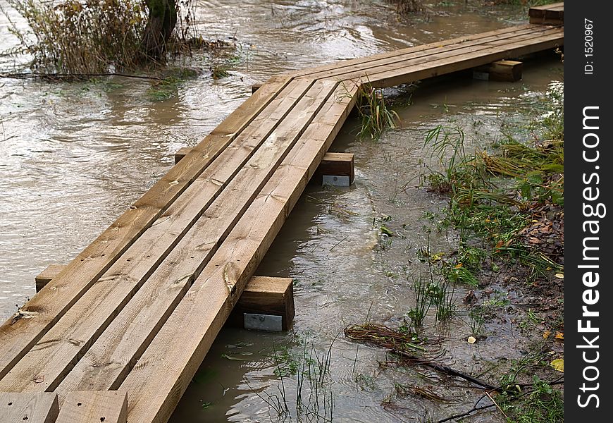 Wooden Bridge Through Flooded River