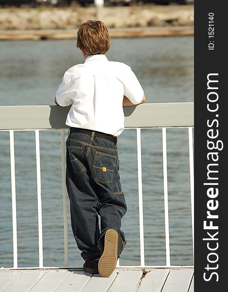 Young Boy On A Dock