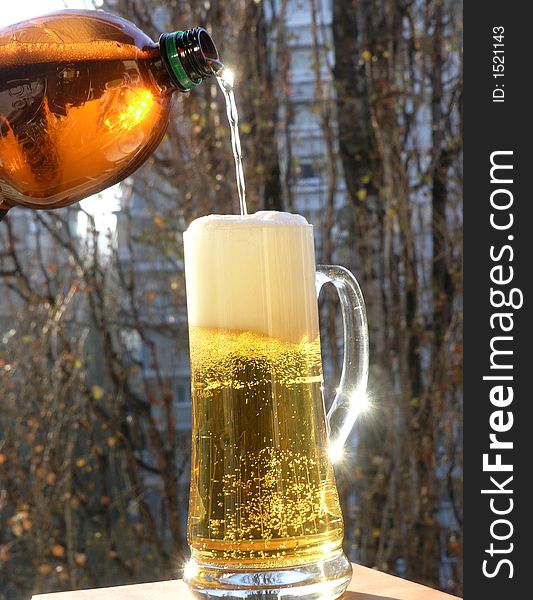 A huge glass of beer on outdoor. A huge glass of beer on outdoor