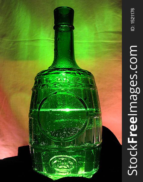 Green bottle filled juicy water. Green bottle filled juicy water