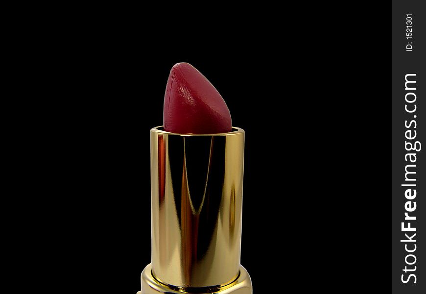 Red lipstick in black background
