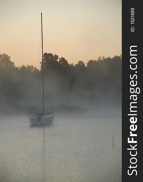 Fishing boat leaving in dawn