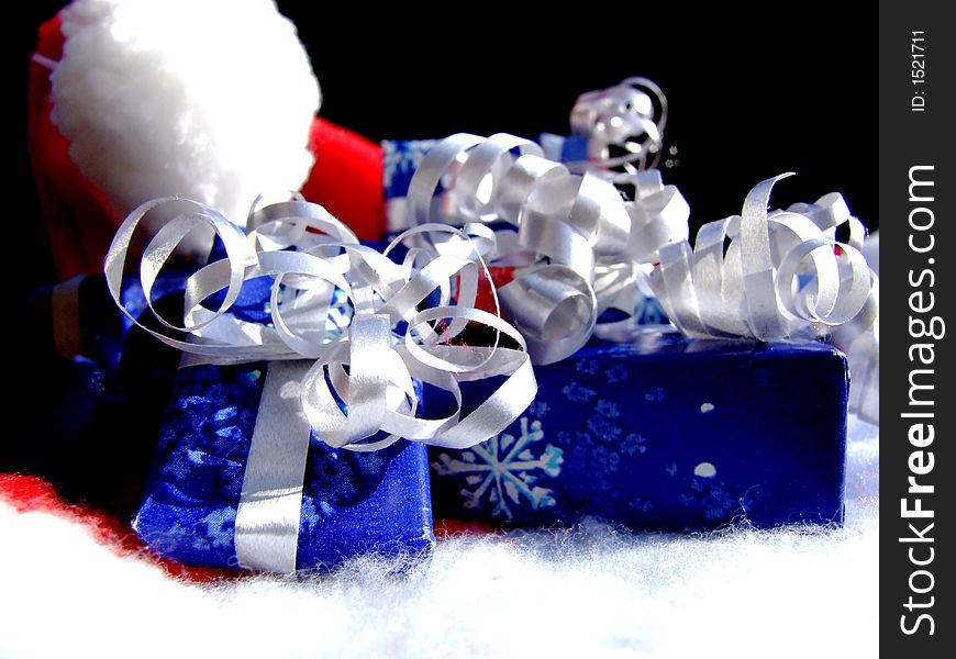 Christmas gifts  in blue and white wrapping with ribbons and bows