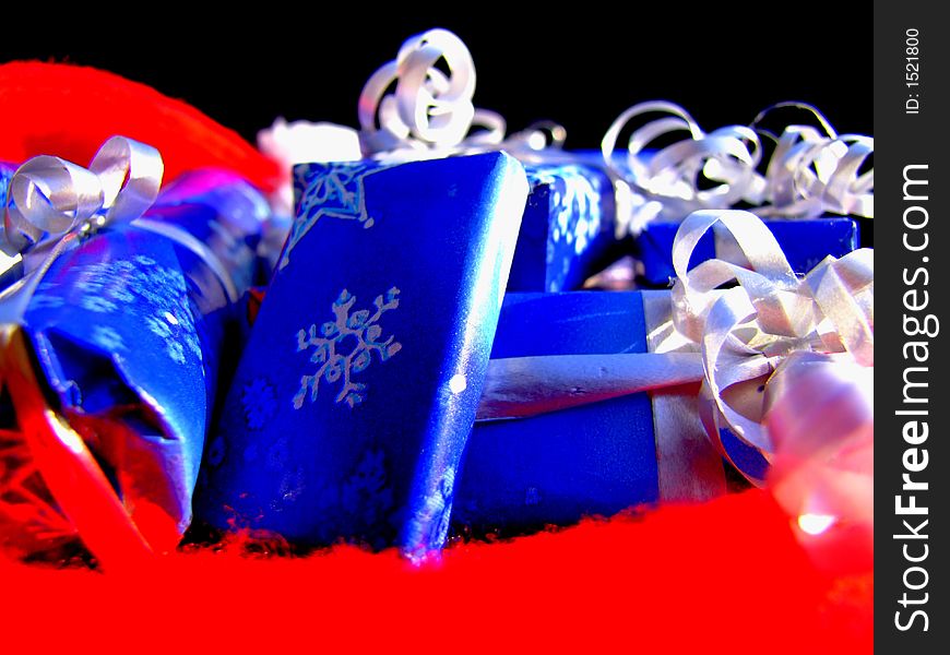 Christmas gifts in blue and white wrapping with ribbons and bows. Christmas gifts in blue and white wrapping with ribbons and bows