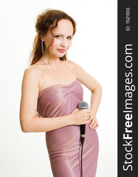 Pretty singer. Woman with microphone on white background.