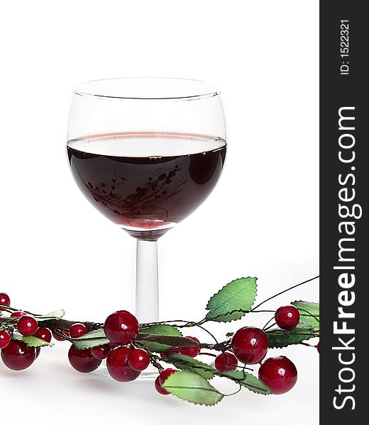 Glass of red wine witch cherry