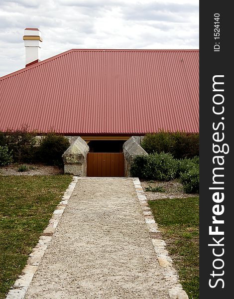 Outdoor Footpath To A House With A Big Red Roof