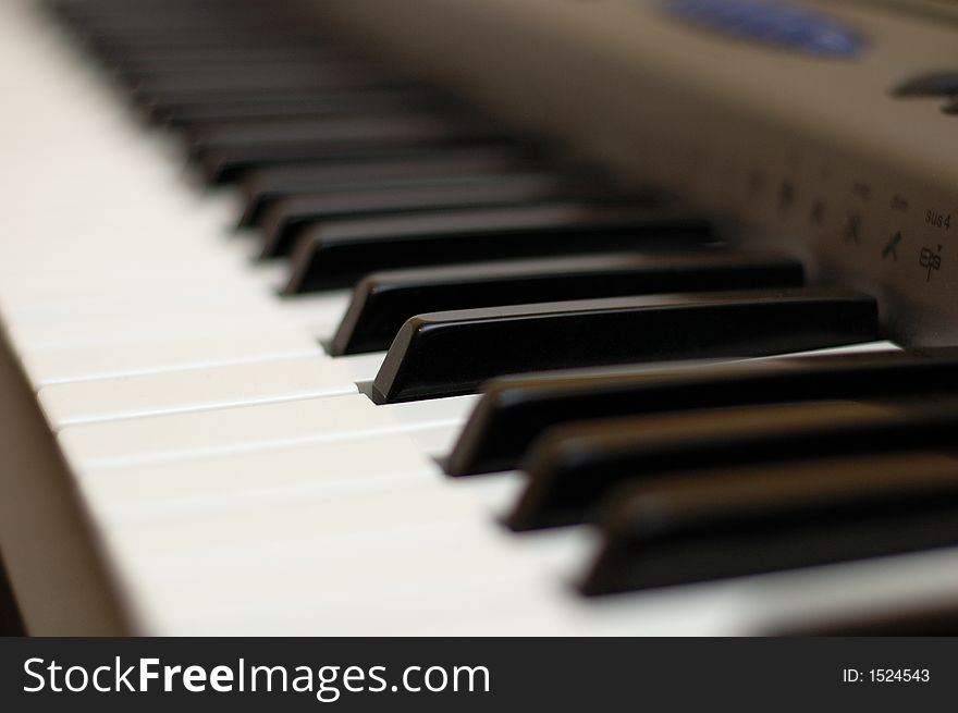 A keyboard of a synthesizer - electronic instrument. Shallow depth of field. A keyboard of a synthesizer - electronic instrument. Shallow depth of field.