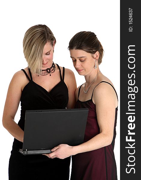 Two women looking at a laptop computer. Two women looking at a laptop computer