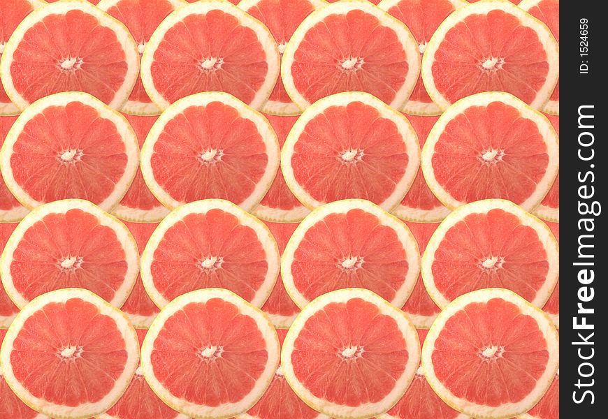 Fresh ruby red grapefruit as a background