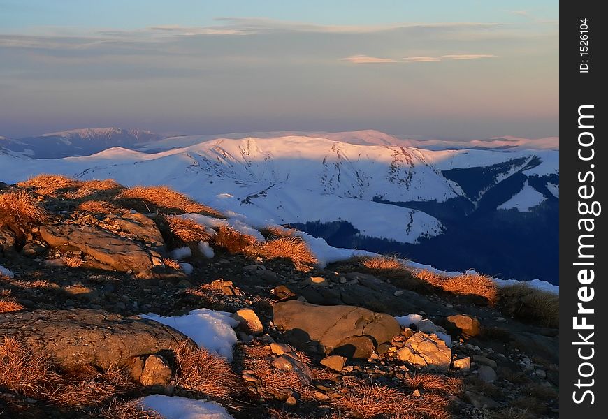 Mountain sunset in winter time