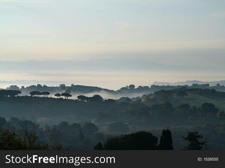 Landscape with hills and fog