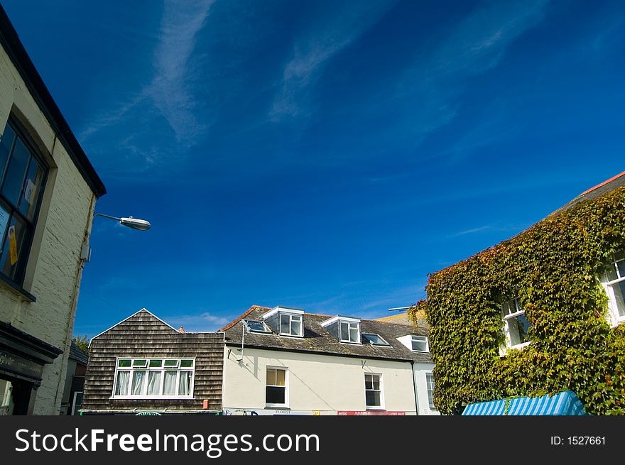 Roofs of buildings and blue sky at padstow,
padstow,
cornwall,
united kingdom. Roofs of buildings and blue sky at padstow,
padstow,
cornwall,
united kingdom.