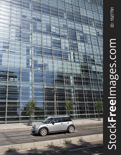 Austin Mini in front a big modern building. Austin Mini in front a big modern building