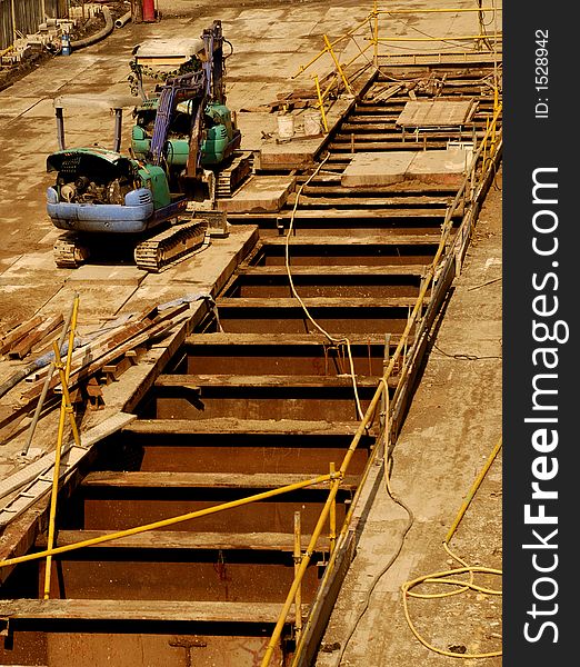 Two excavators resting at the construction site