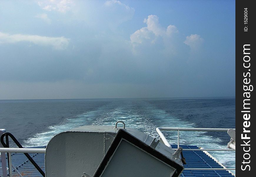 An image showing water trail leaved by a ship. An image showing water trail leaved by a ship